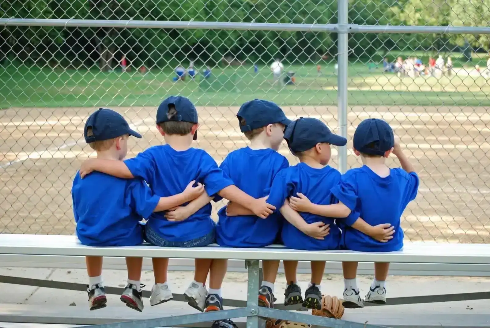 Kids Sitting and holding each other